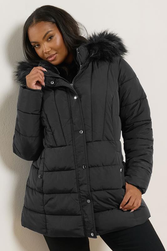 Longline Black Puffer with Faux Fur Hood Detail Longline Black Puffer with Faux Fur Hood Detail — Winter Puffer Jacket Outfits