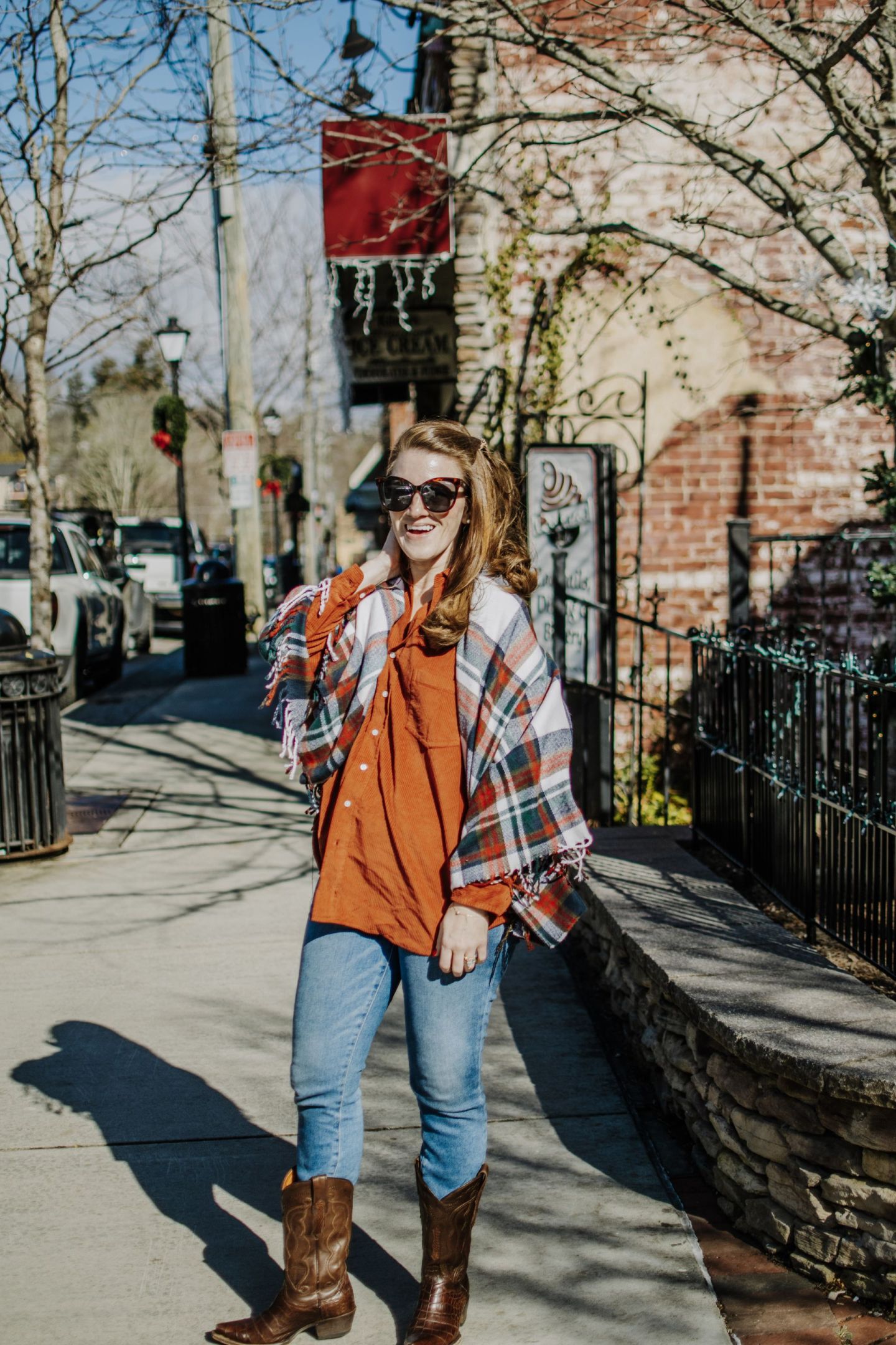 Orange Shirt, Jeans, and Cowboy Boots with Plaid Scarf Orange Shirt, Jeans, and Cowboy Boots with Plaid Scarf — Nashville Winter Outfits