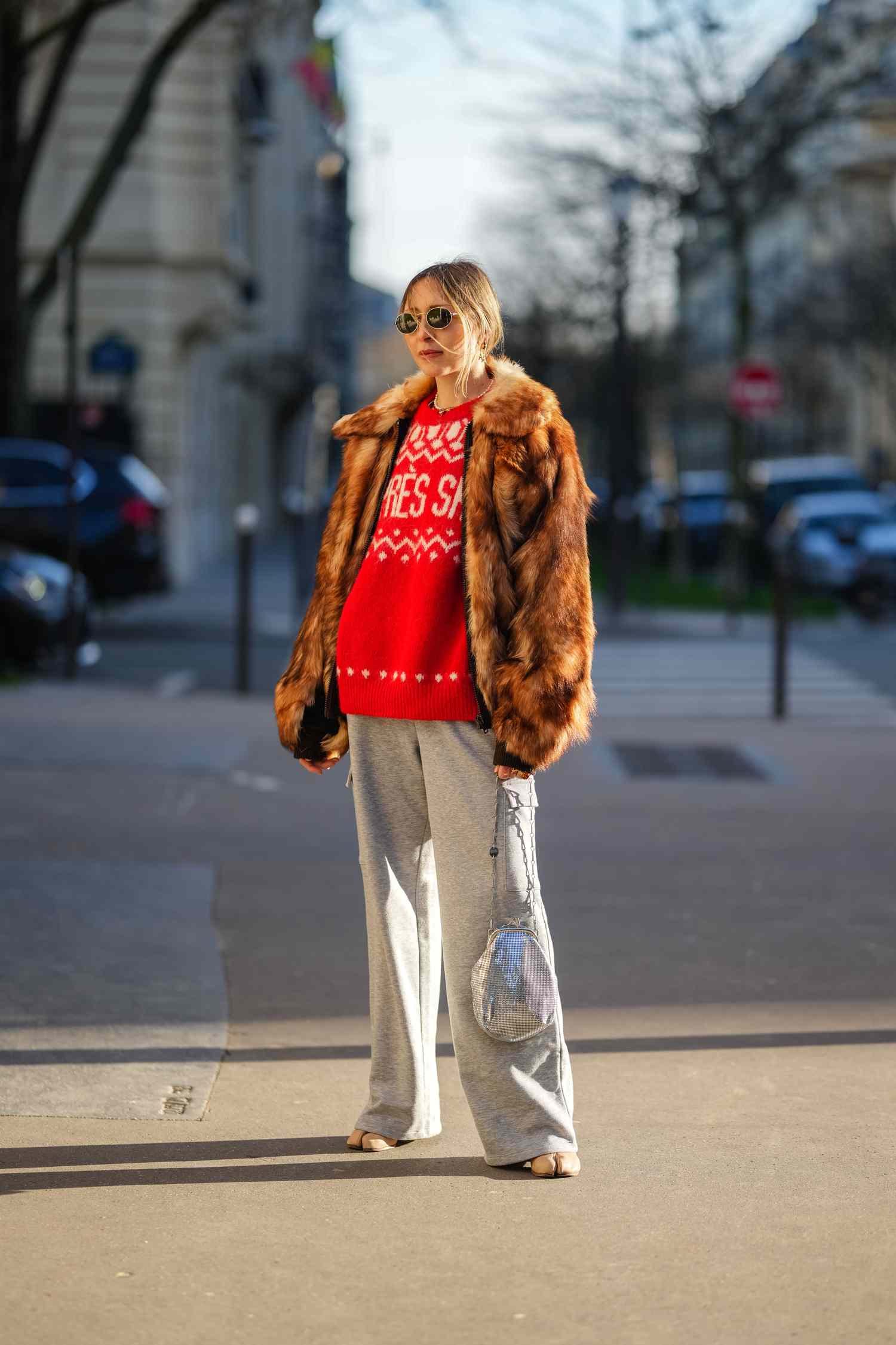 Luxurious Layers: Fur Jacket over Graphic Sweater and Grey Pants Luxurious Layers: Fur Jacket over Graphic Sweater and Grey Pants — February Outfits