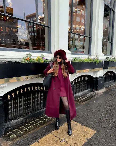 London tourists in full swing✨ … comment L1 for the outfit details outfit recipe: burgundy sweater dress & long jacket paired with knee high boots & a fur hat #eurowinters #winteroutfitideas #coldweatheroutfit
