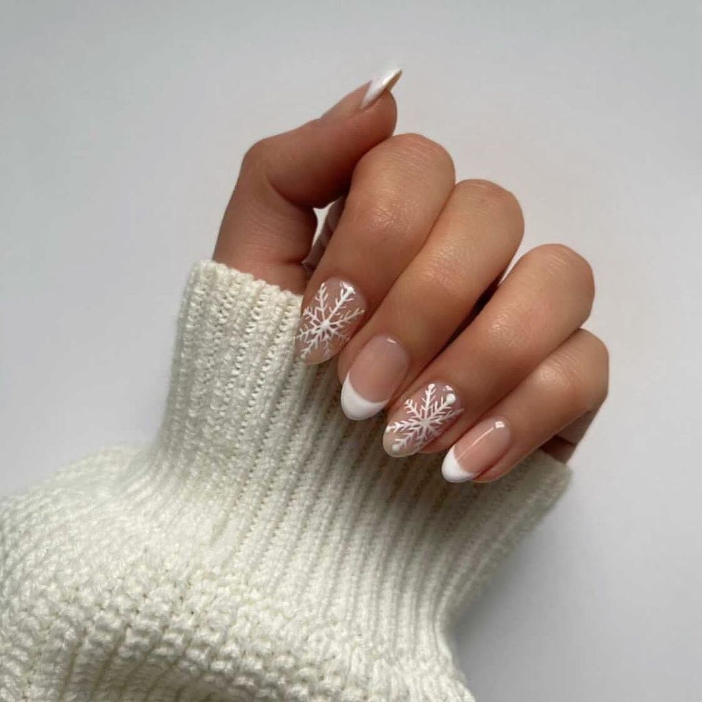 White Snowflakes On Tips Sheer Pink French Tip Snowflake Ovals White Snowflakes On Tips Sheer Pink French Tip Snowflake Ovals — Snowflake Nails