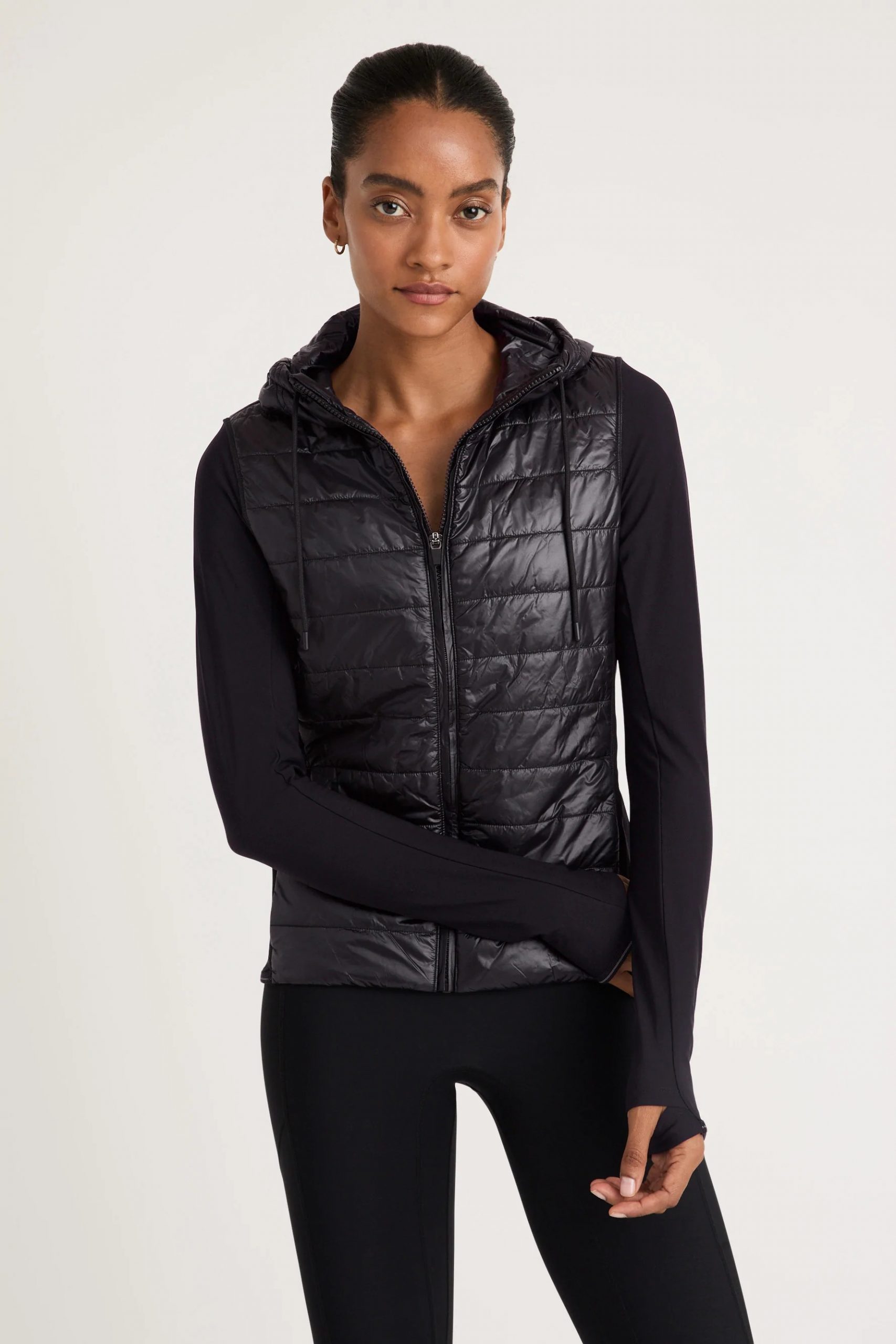 Monochromatic Black Puffer Vest and Leggings for Workouts — Winter Workout Outfits