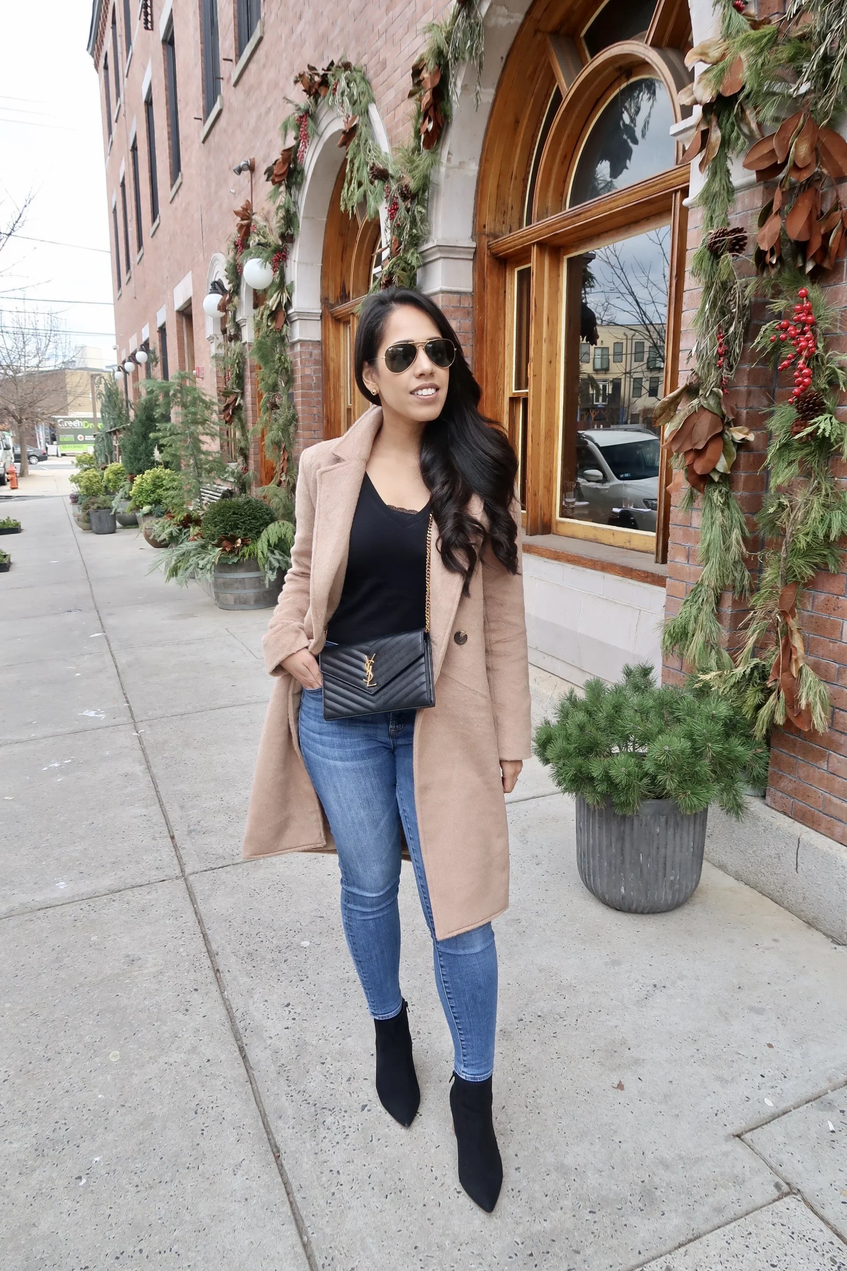 Camel Coat Adds Warmth to Black Top and Blue Skinny Jeans — Neutral Winter Outfits