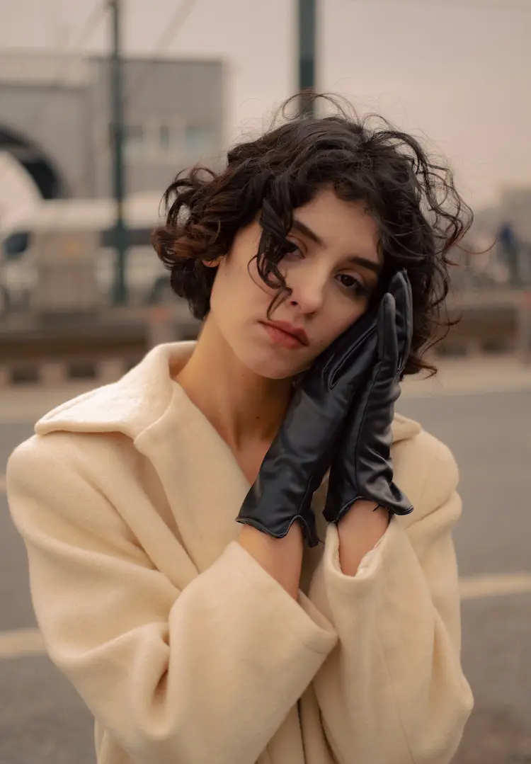 Dark Brown Curly Bob With Wispy Bangs Dark Brown Curly Bob With Wispy Bangs — Winter Haircuts for Curly Hair