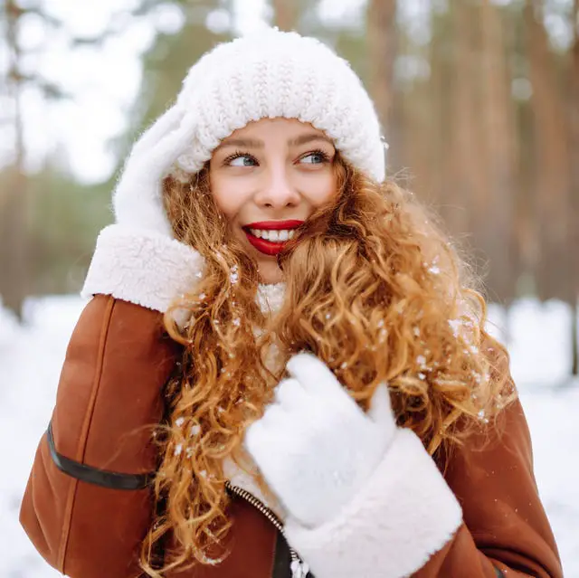 Auburn Curls with Curtain Bangs — Winter Hairstyles for Curly Hair