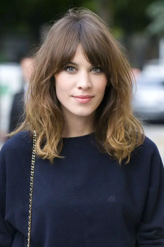 Shoulder-Length Lob with Wispy Bangs Shoulder-Length Lob with Wispy Bangs — Winter Haircuts for Oval Faces