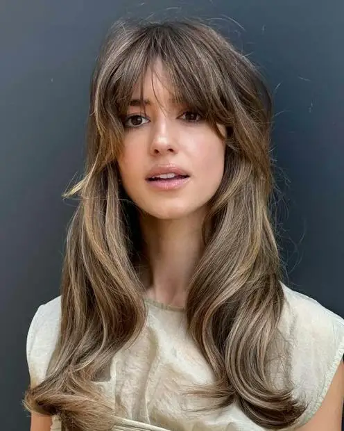 Collarbone Layered Shag With Curtain Bangs Collarbone Layered Shag With Curtain Bangs — Winter Haircuts for Wavy Hair