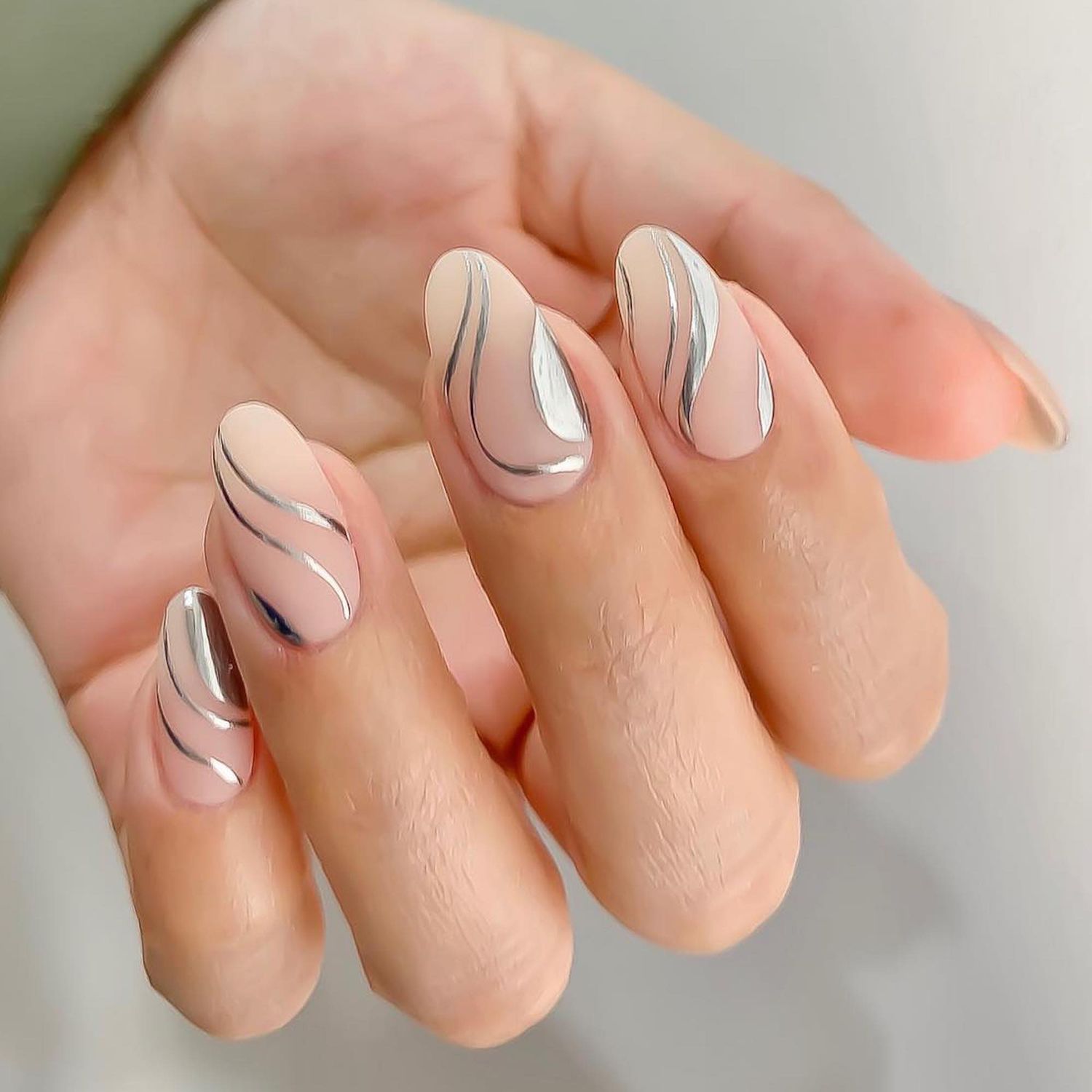 Sheer Nude Silver Wavy Lines Sheer Nude Silver Wavy Lines — Short Winter Almond Nails