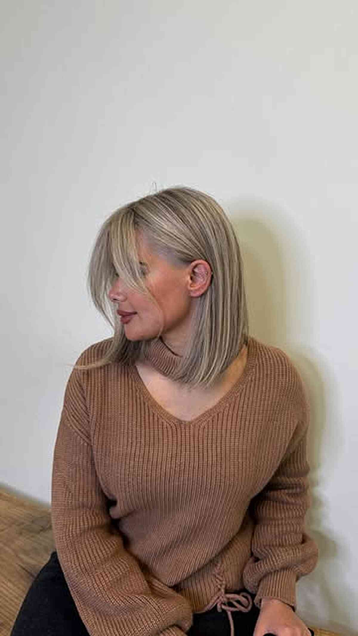Chin-Length Bob With Side-Swept Bangs and Ash Blonde Lowlights Chin-Length Bob With Side-Swept Bangs and Ash Blonde Lowlights — Lowlights for Blonde Hair