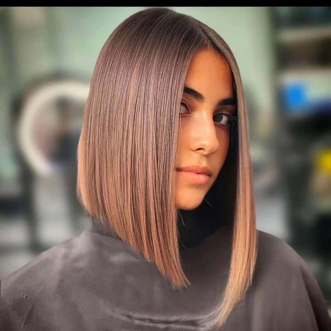 Long rose beige bob with center part and straight ends