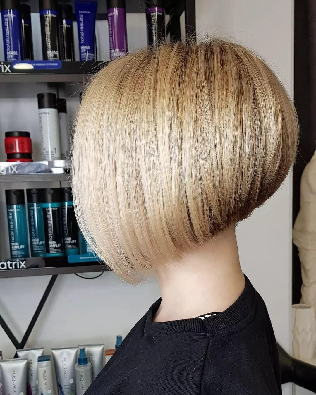 Blonde bob with rounded back, short nape, and longer front