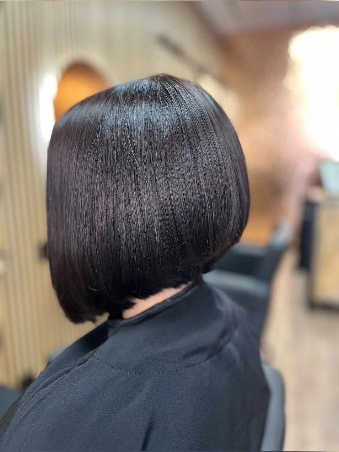 Dark rounded bob viewed from the back and side