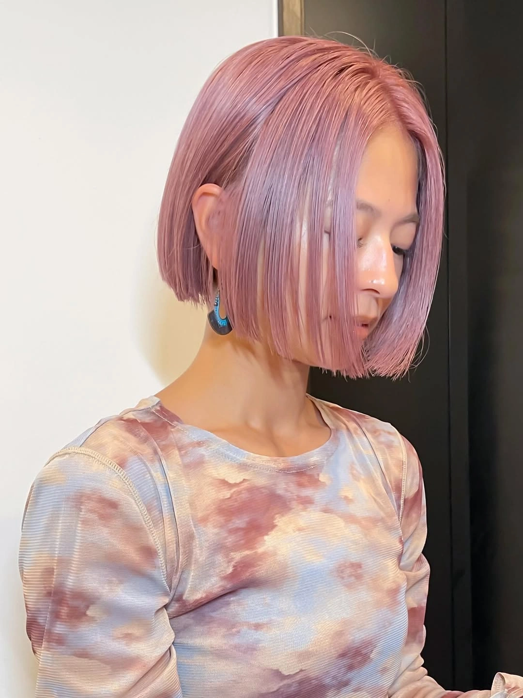 Pastel pink bob with tucked side and long front