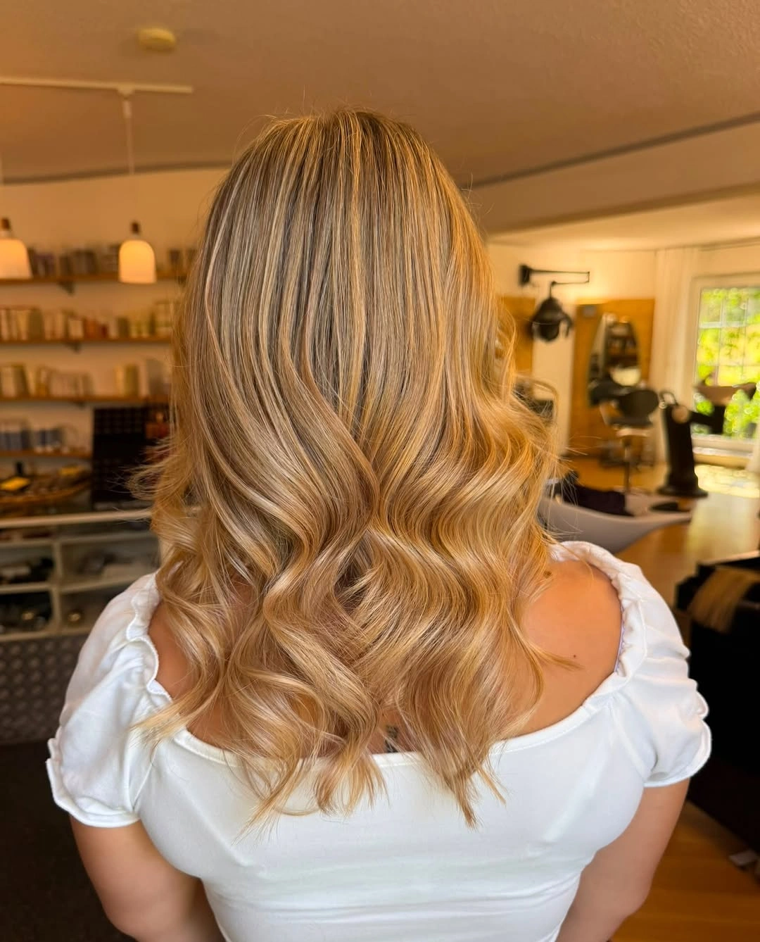 Back view of golden caramel blonde waves