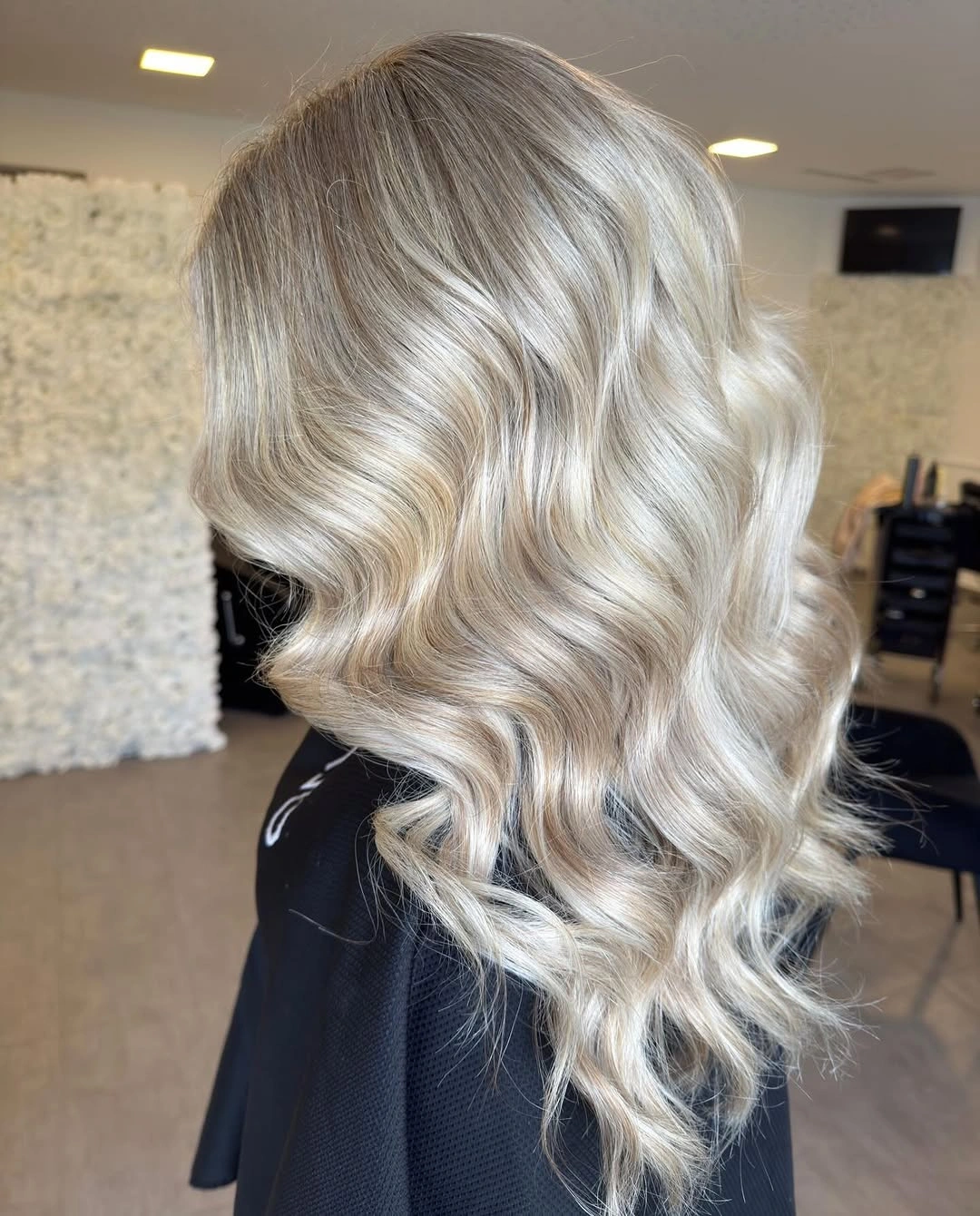 Medium pearl blonde hair with loose S-shaped waves
