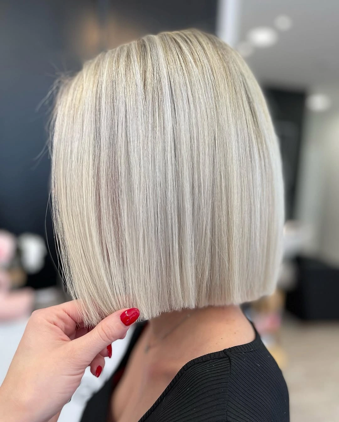 Short blunt silver-beige blonde bob with straight edge