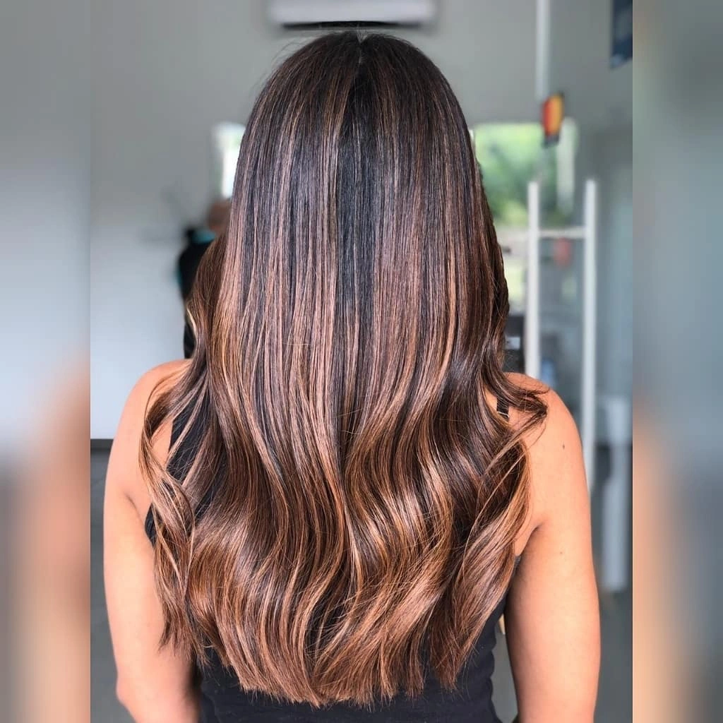 Long brunette hair with fine copper-brown vertical highlights