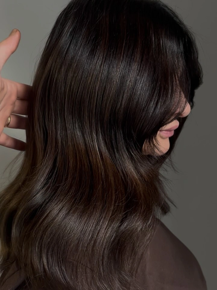 Long near-black brunette hair with faint warm pieces