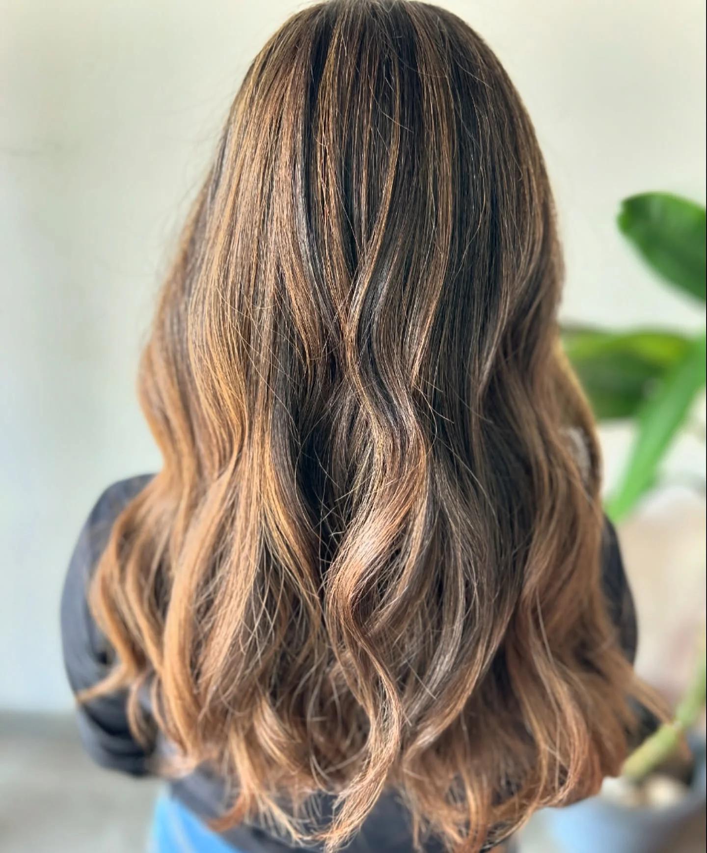 Long brunette waves with warm caramel-honey ribbons