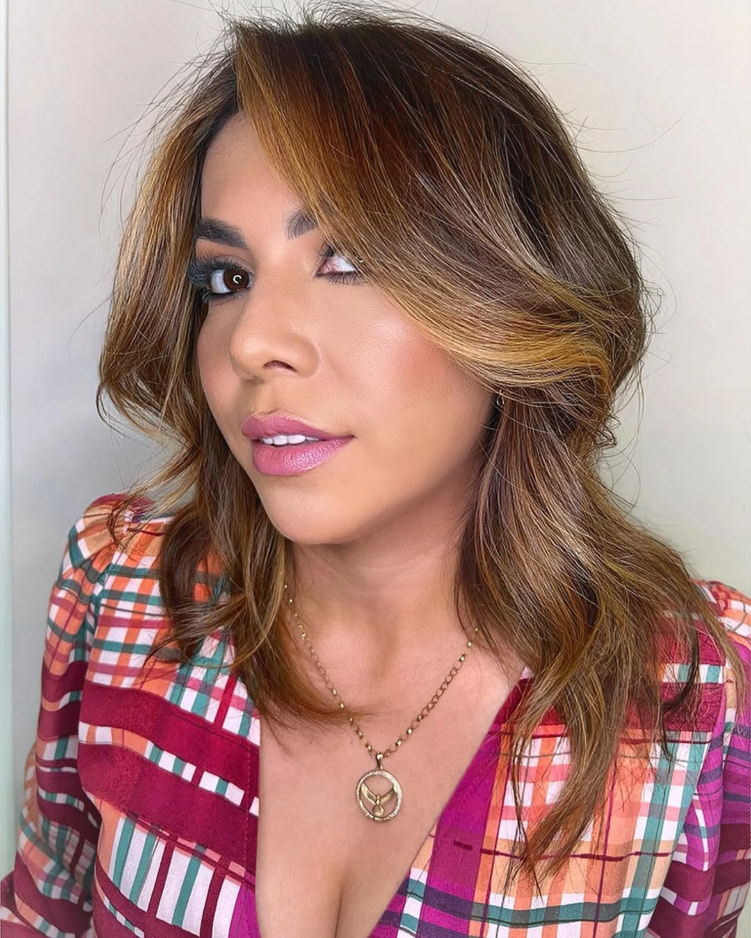 Medium brunette waves with golden caramel face pieces