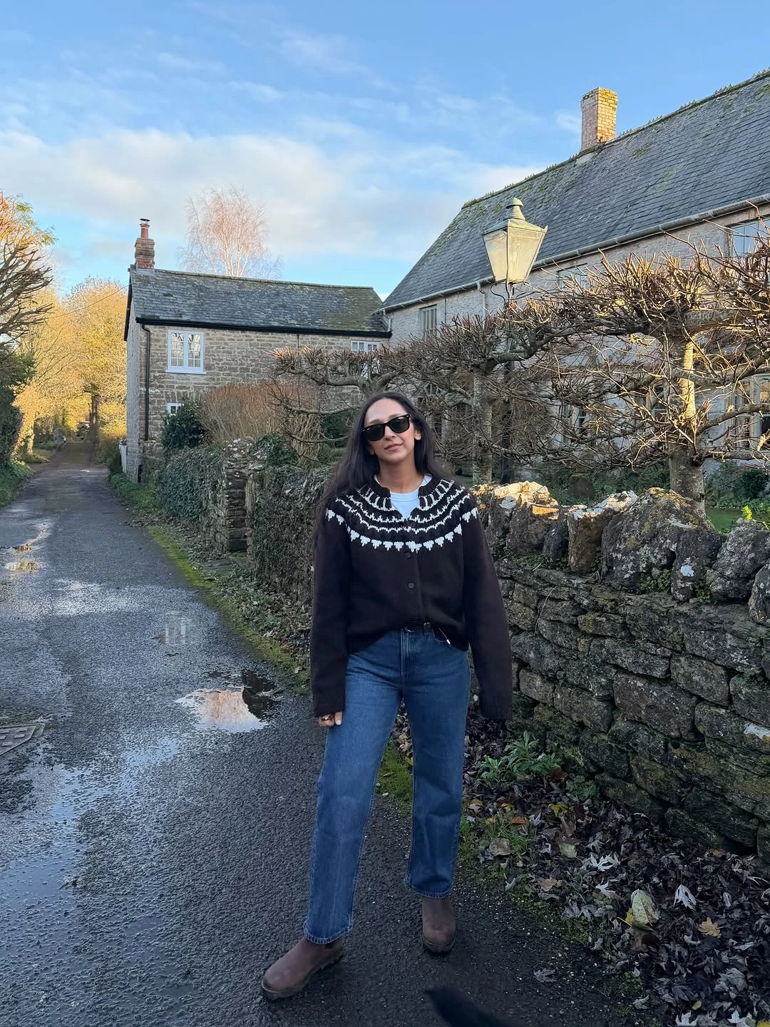 Dark patterned knit with straight blue jeans and brown ankle boots