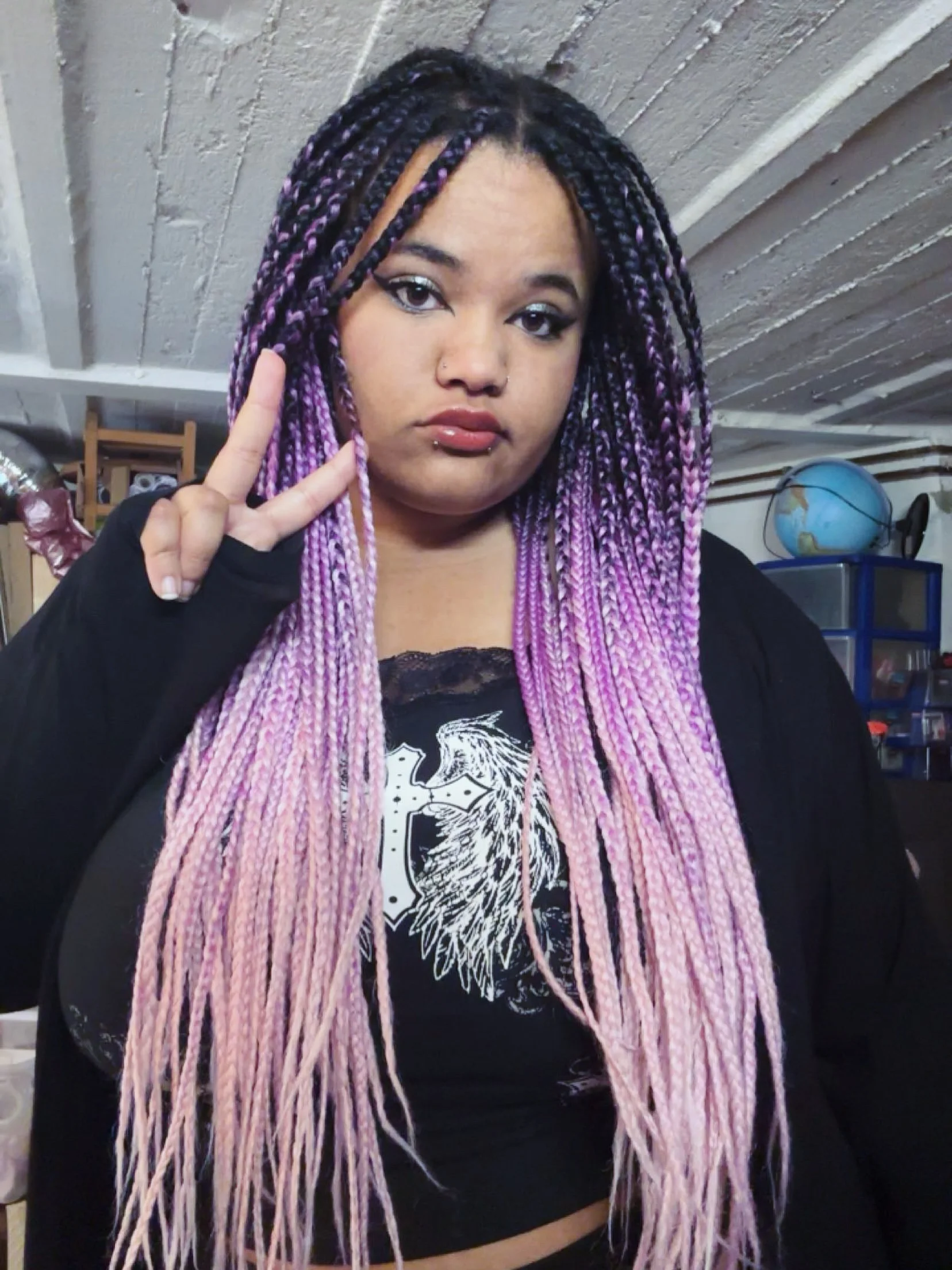 Long ombré braids fading from dark roots to pale pink