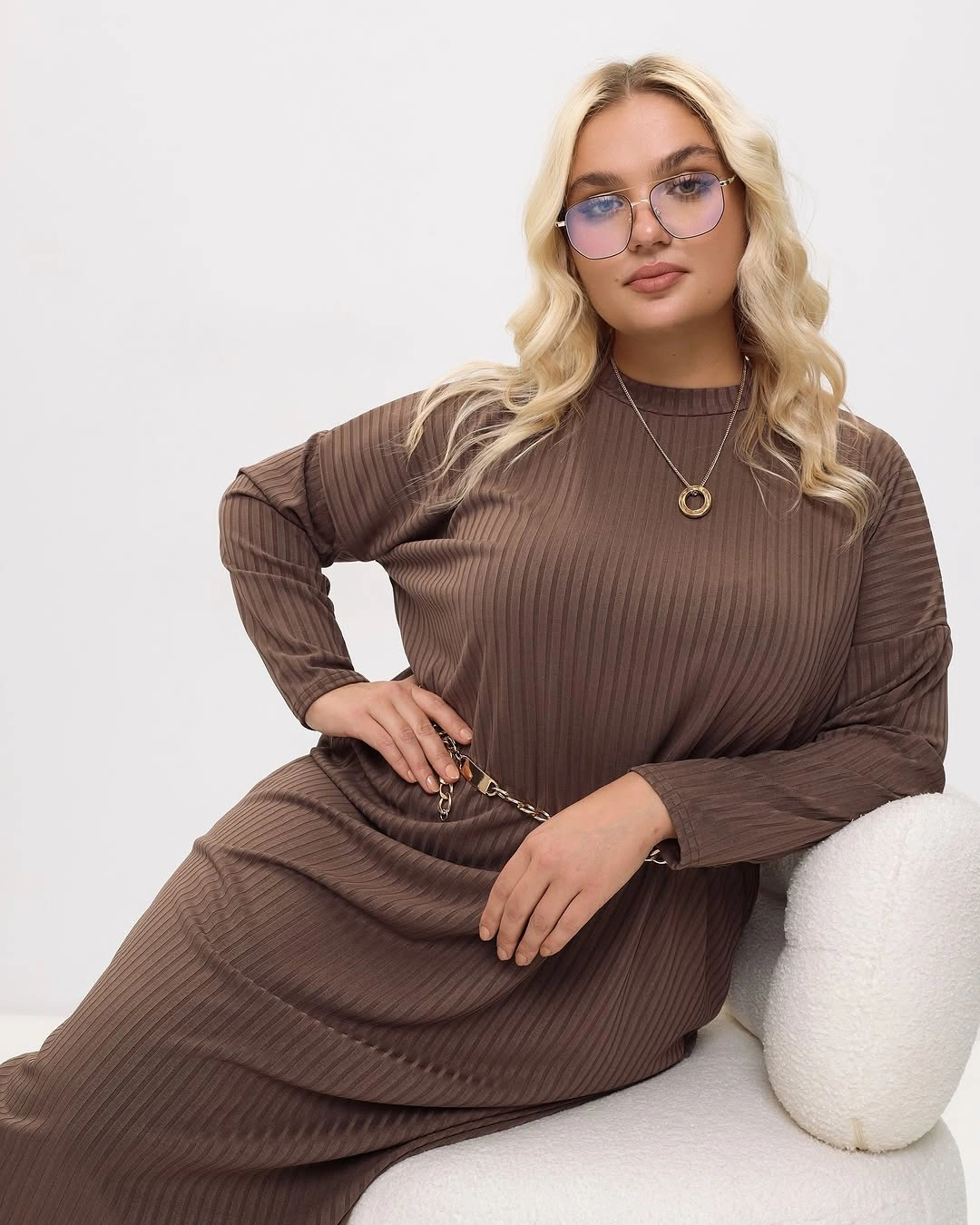 Long blonde waves with glasses and brown ribbed dress