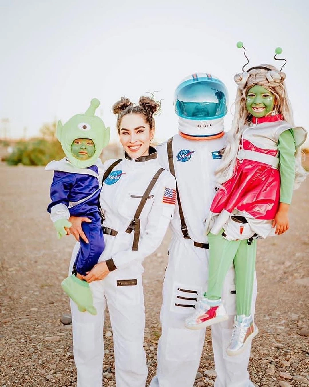 Family Halloween costumes with astronauts and bright cartoon characters