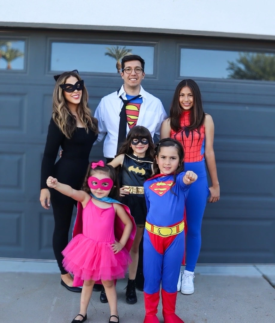 Superhero family Halloween costumes with bright pink tulle dress