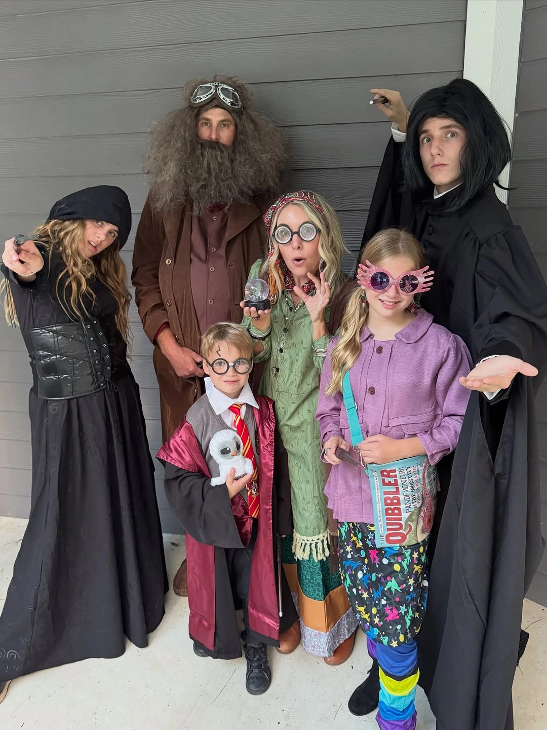 Wizard family Halloween costumes with colorful fantasy children outfits