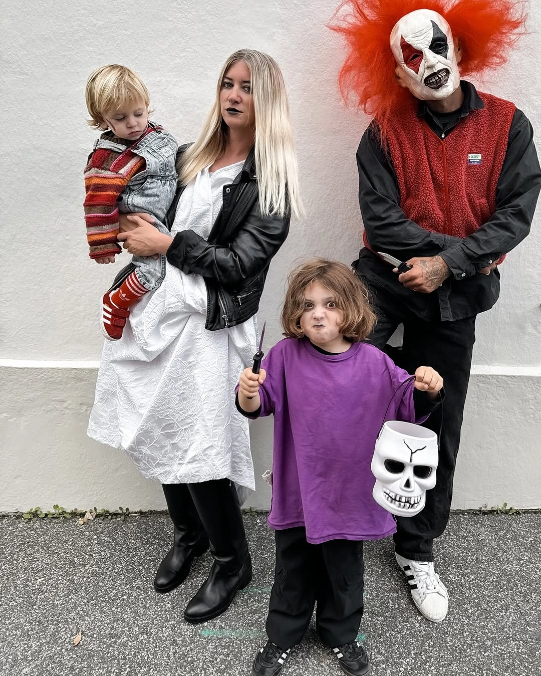 Dalmatian-inspired family Halloween look with leather jacket and toddler