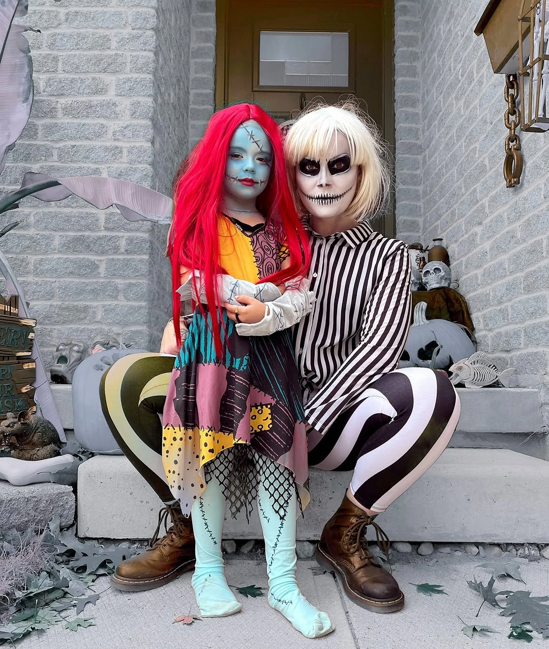 Black-and-white striped family Halloween costumes with red wig and green hair