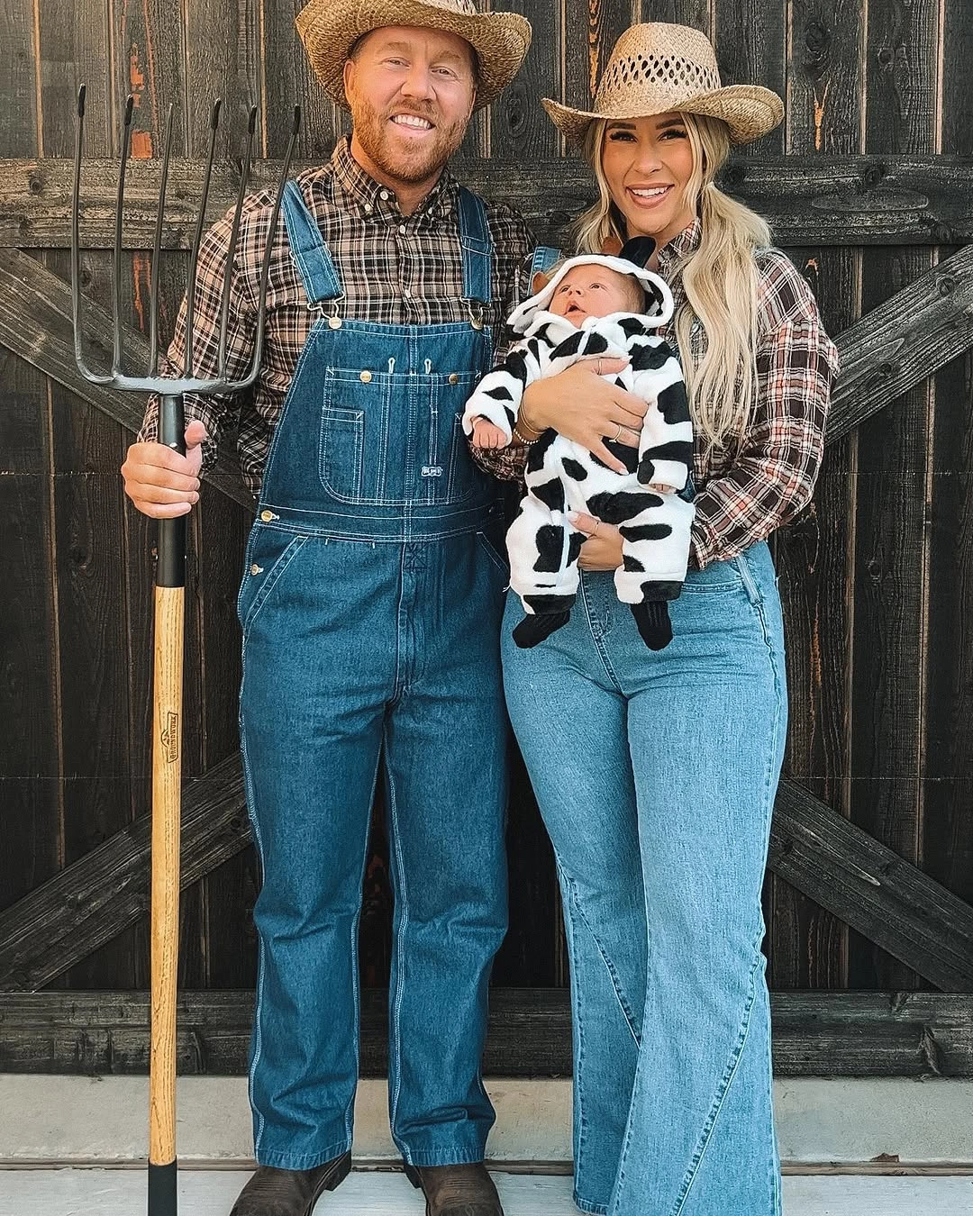 Farm family Halloween costume with denim overalls and spotted baby