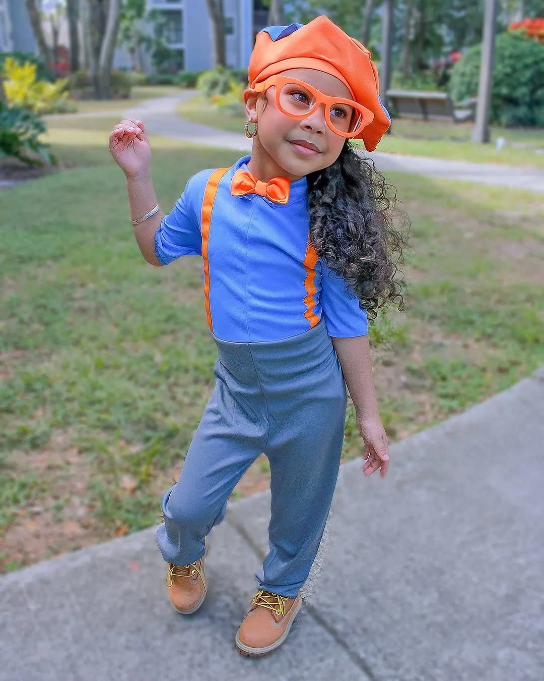 Blue and orange cartoon-inspired Halloween costume with oversized glasses