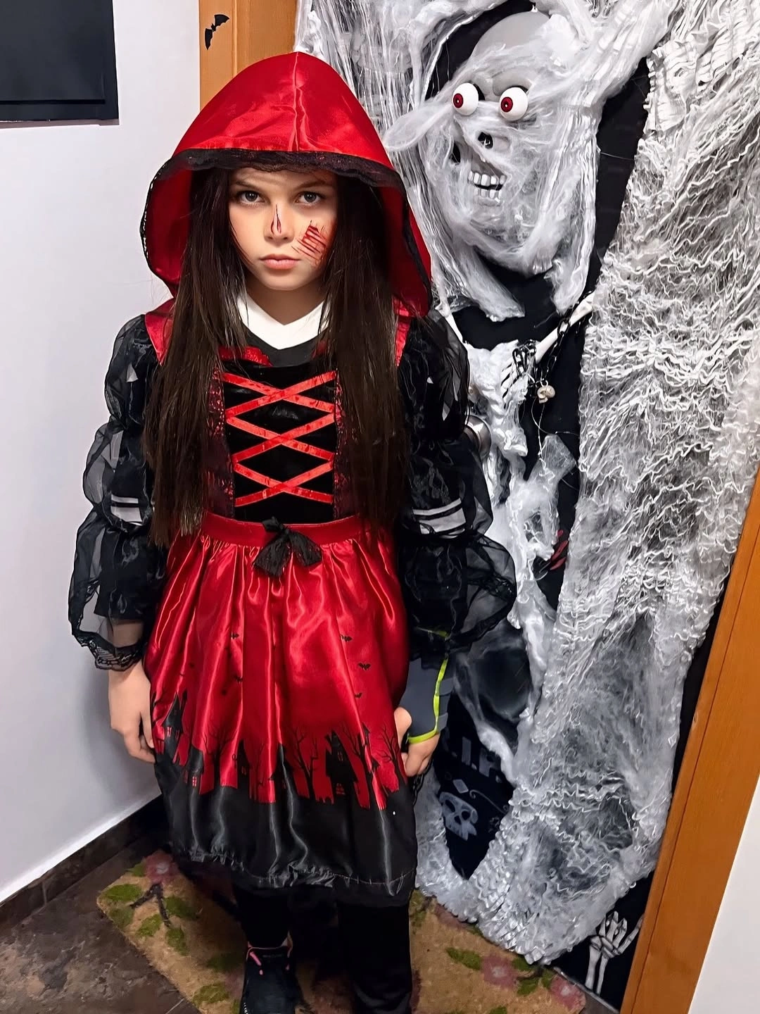 Red hooded Halloween dress with black lacing and dark trim