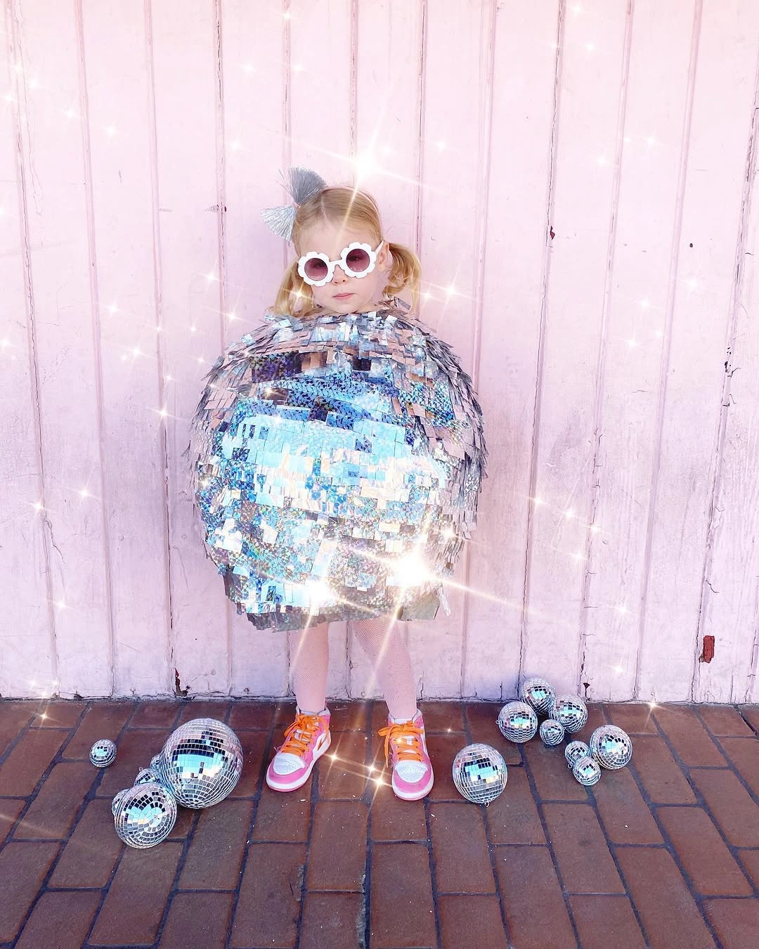 Silver mirrored disk Halloween costume with white round glasses and pink sneakers