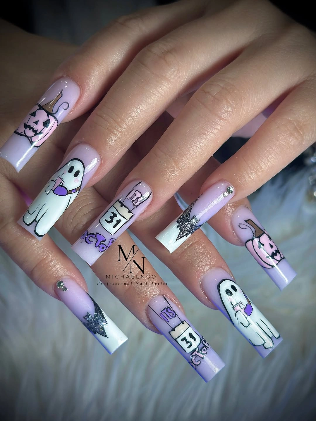 Long lavender square Halloween nails with ghost pumpkin and star
