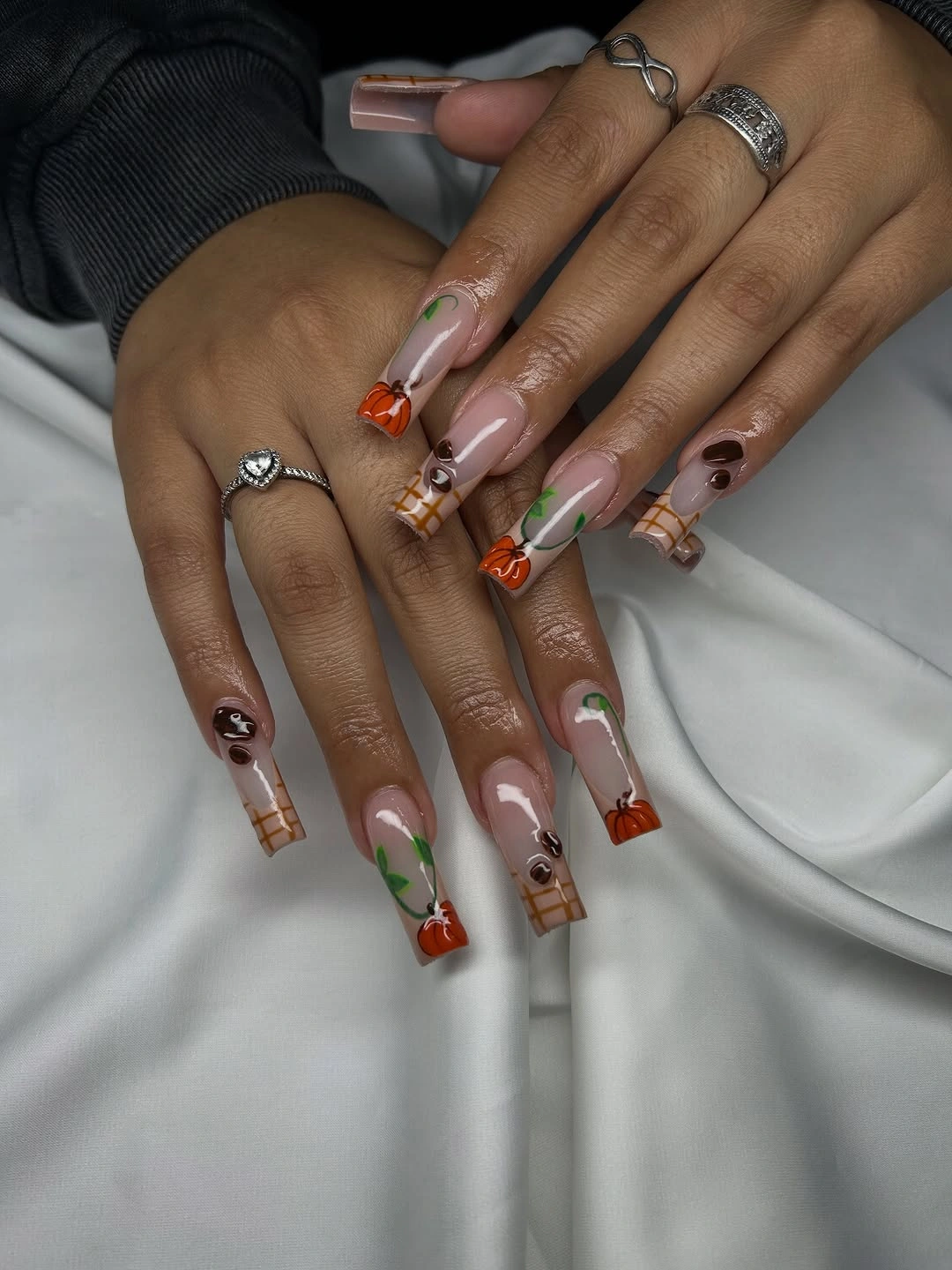 Long nude square nails with pumpkins green vines and ghosts