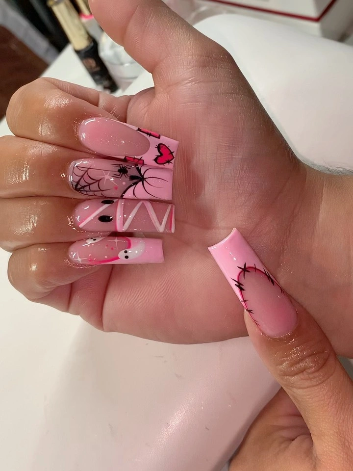 Long pink square nails with black webs bats stripes and ghost