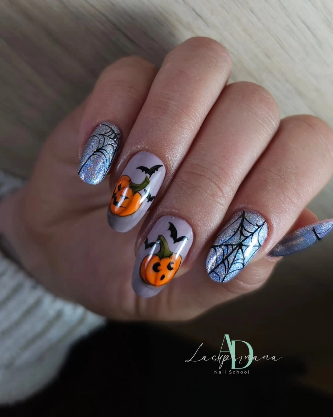 Gray Halloween nails with pumpkin faces bat and silver web