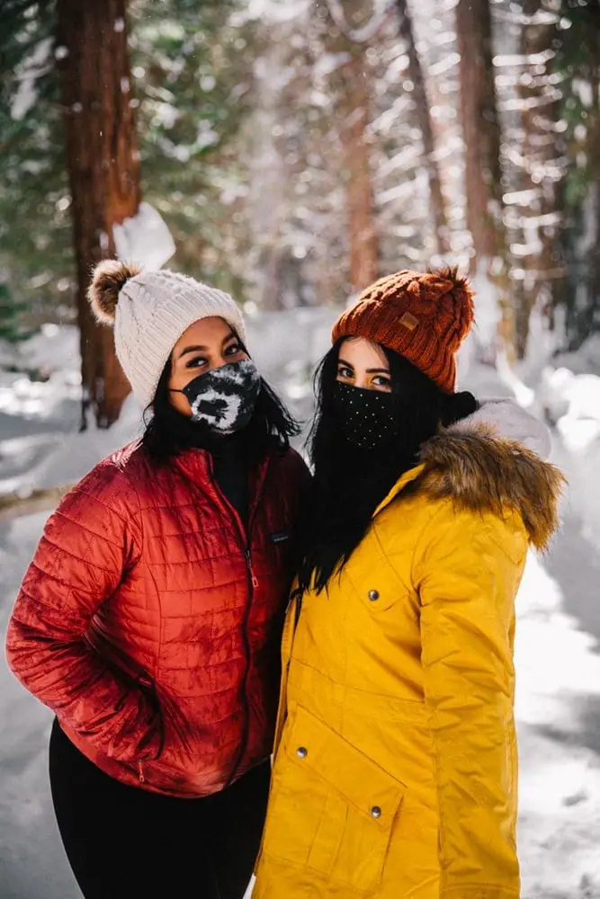 All-Black Base Layer with Red Puffer and Pom-Pom Beanie — Winter Hiking Outfits