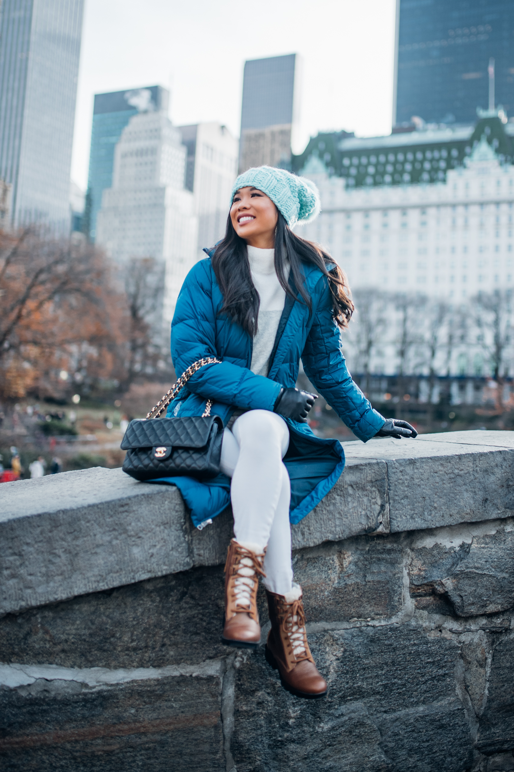 Brown Lace-Up Boots with White Skinny Jeans and a Puffer Coat — Winter Boots Outfits