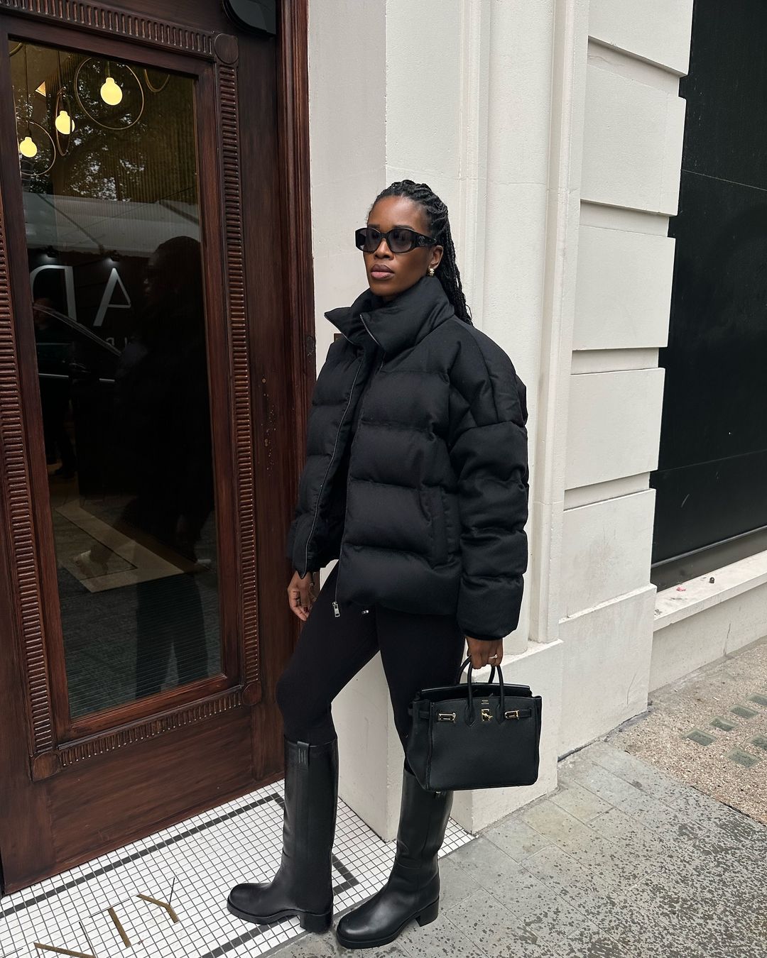 Monochromatic Black Look with Knee-High Boots and Puffer Jacket — Winter Boots Outfits
