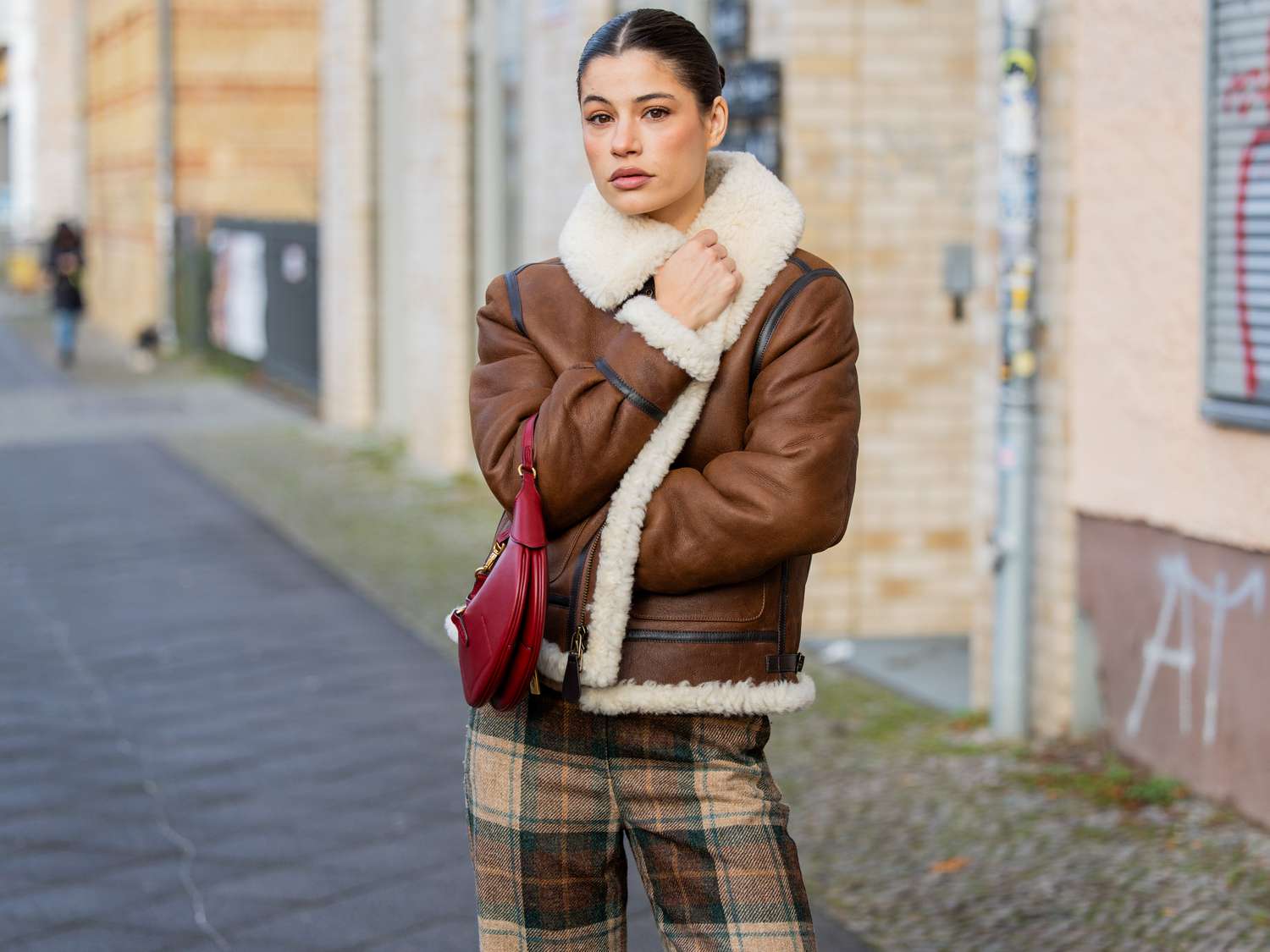 Shearling Aviator Jacket with Plaid Pants and Red Bag — Colorful Winter Outfits