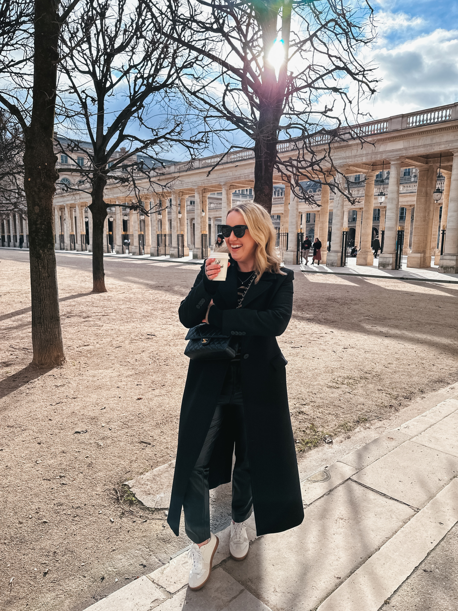 Monochromatic Polish: Long Black Coat with White Sneakers Monochromatic Polish: Long Black Coat with White Sneakers — Chicago Winter Outfits