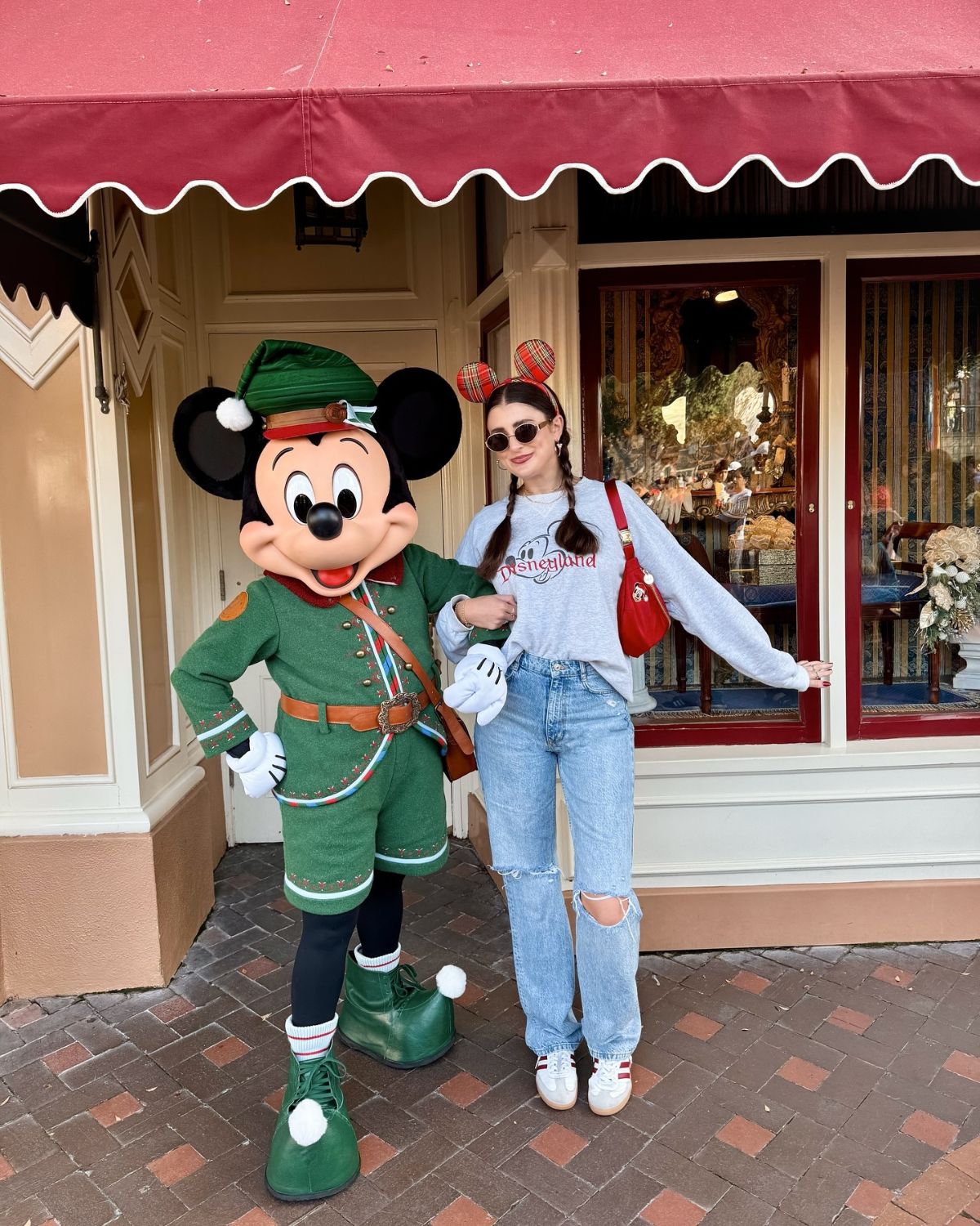 Grey Disney Sweatshirt with Ripped Jeans for a Theme Park Day Grey Disney Sweatshirt with Ripped Jeans for a Theme Park Day — Disney Winter Outfits