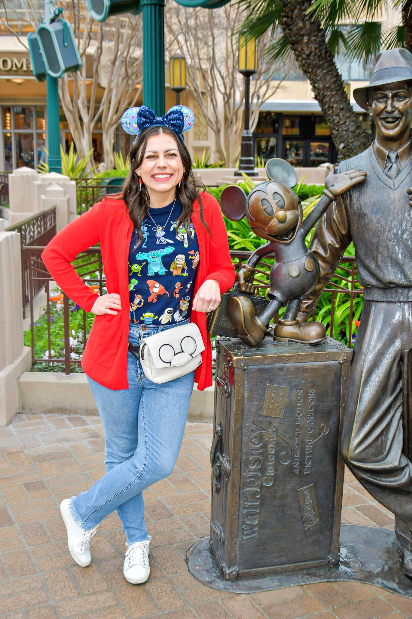Vibrant Red Cardigan Over Graphic Tee for Theme Park Fun Vibrant Red Cardigan Over Graphic Tee for Theme Park Fun — Disney Winter Outfits