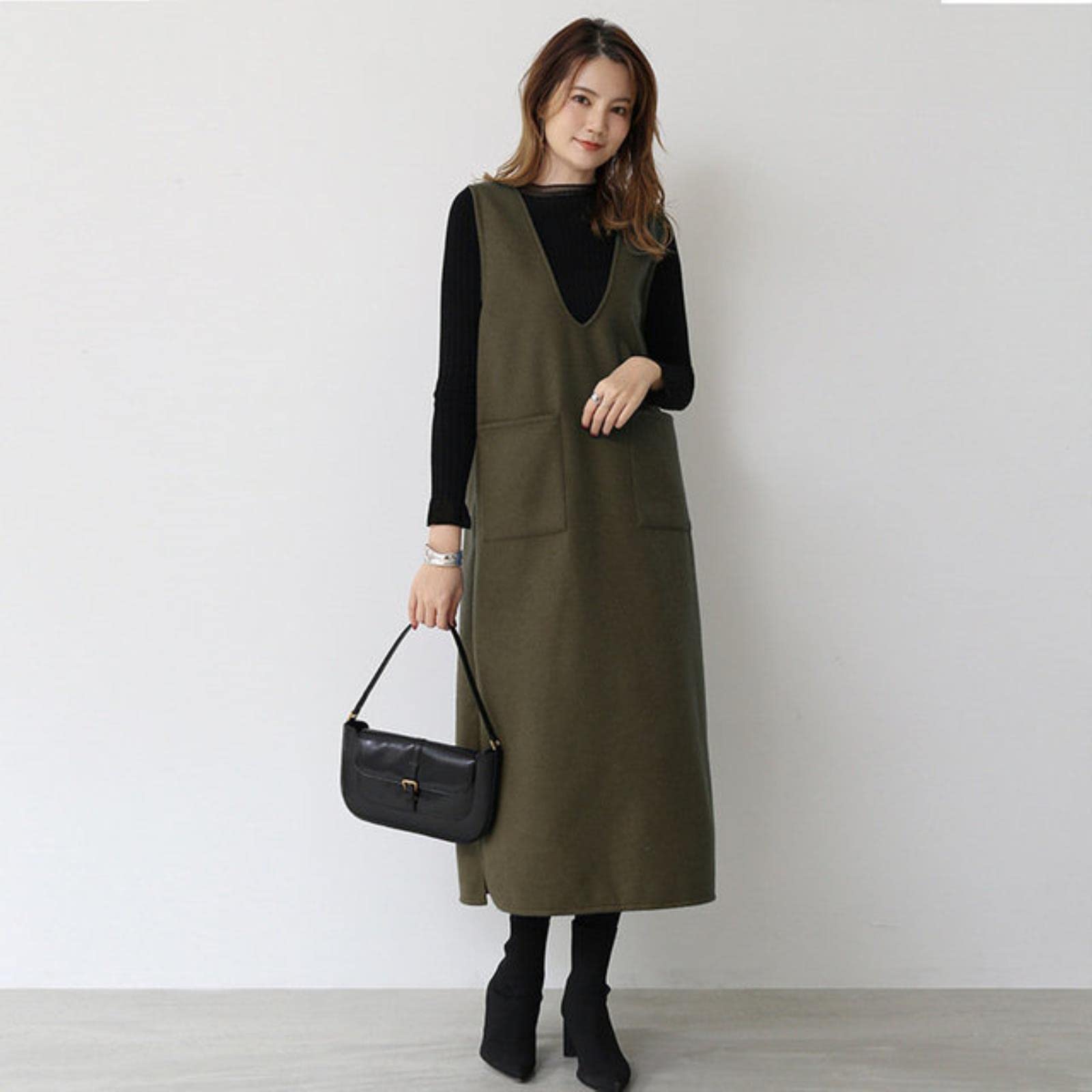 Chic Utility: Olive Green Pinafore Dress with Black Layers — Japan Winter Outfits