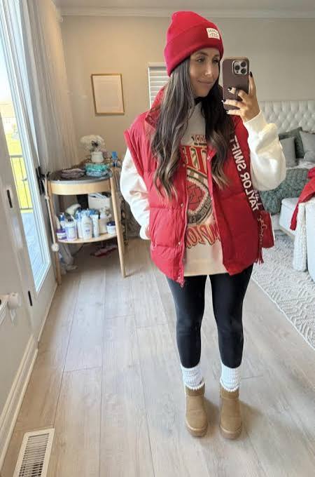 Puffer Vest and Graphic Sweatshirt with Shearling Boots Puffer Vest and Graphic Sweatshirt with Shearling Boots — Cold Weather Game Day Outfits