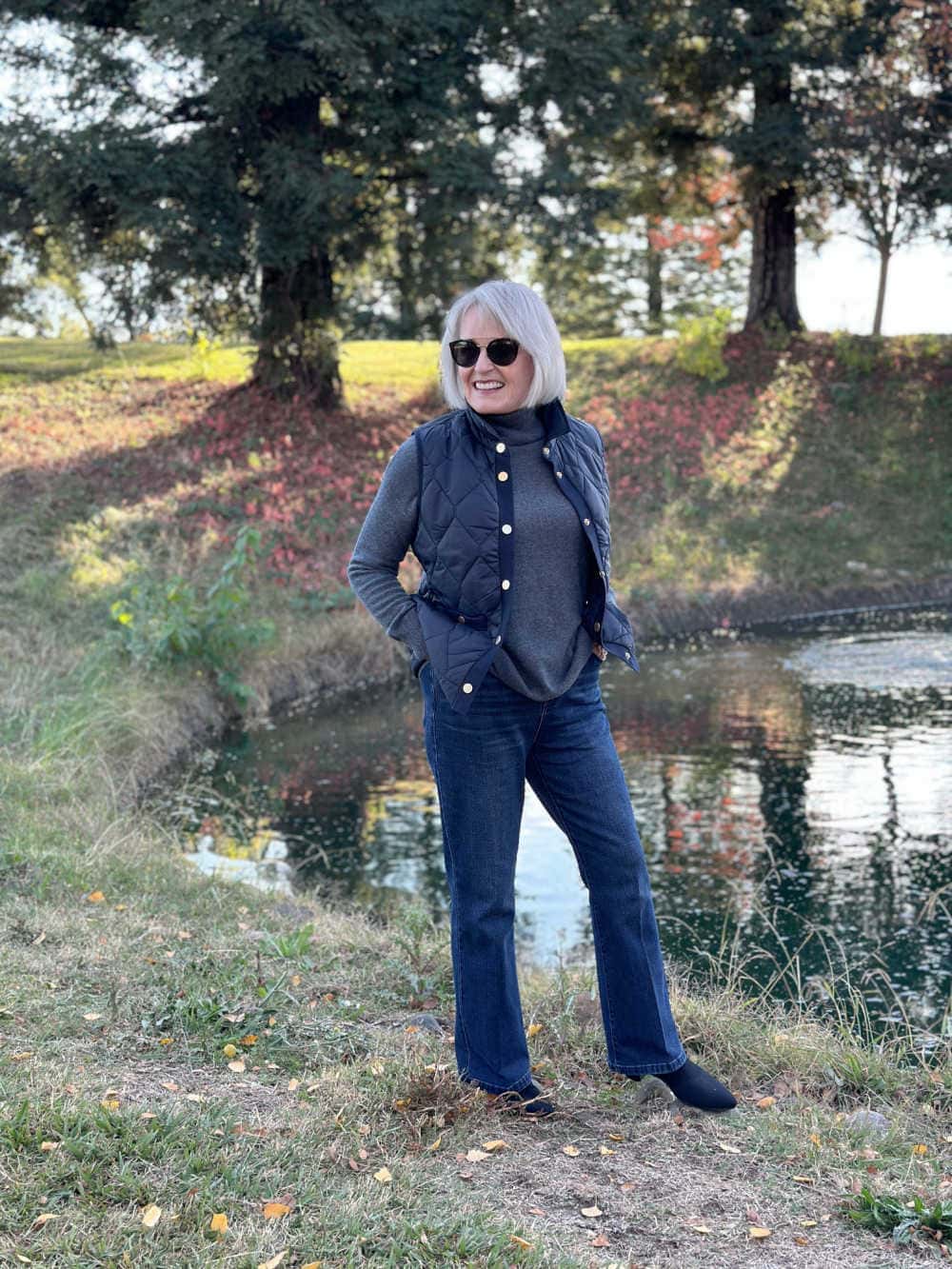 Navy Quilted Vest Over Grey Turtleneck with Denim — Winter Outfits for Older Women